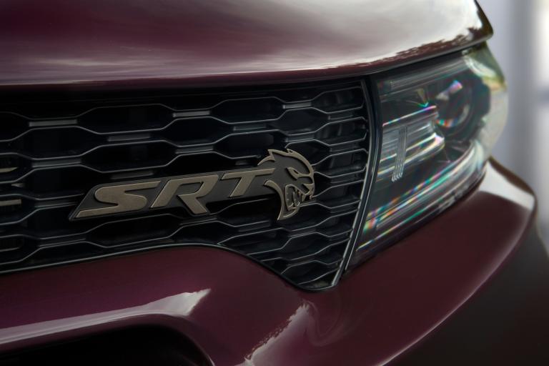 Brass Monkey Hellcat grille badging on the 2022 Dodge Charger SRT Hellcat Redeye Widebody Jailbreak. Charger Jailbreak models offer the choice of five exterior badging finishes.