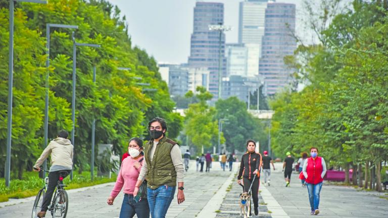 Mexico City, Mexico ; September 20 2020: People enjoying the forest of chapultepec during ìthe new normali some with face masks and some not post covid 19