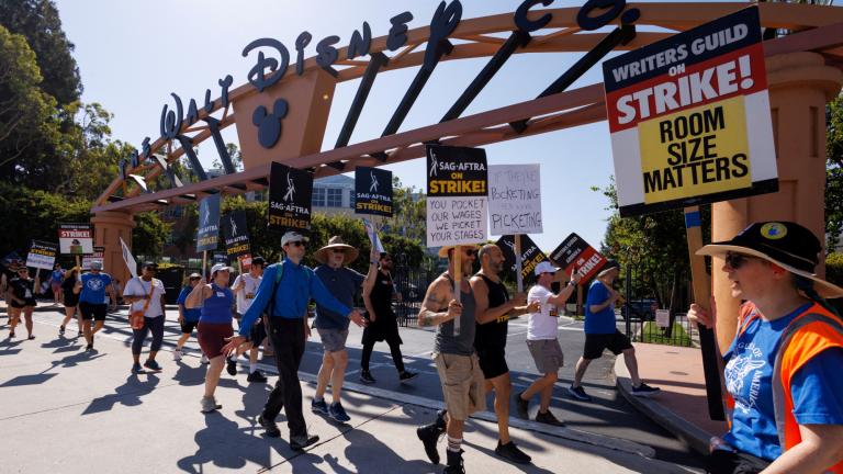 FILE PHOTO: Hollywood actors and writers on strike outside Disney studios in California