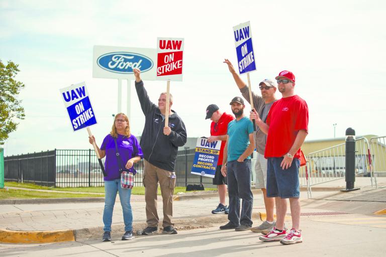 WAYNE, MICHIGAN - SEPTEMBER 16: United Auto Workers members strike at the Ford Michigan Assembly Plant on September 16, 2023 in Wayne, Michigan. This is the first time in history that the UAW is striking all three of the Big Three auto makers, Ford, General Motors, and Stellantis, at the same time.   Bill Pugliano/Getty Images/AFP (Photo by BILL PUGLIANO / GETTY IMAGES NORTH AMERICA / Getty Images via AFP)