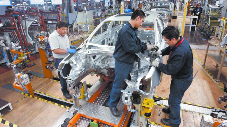 Employees work on the assembly line on the Jetta Bicentennial at the Volkswagen automobile manufacturing factory in Puebla