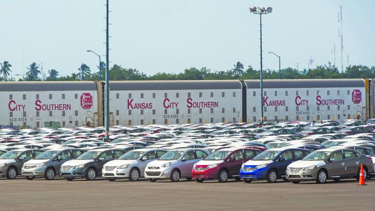 TO GO WITH AFP STORY BY LAURENT THOMETA large open area to store imported cars at the Lazaro Cardenas port, one of the biggest of the country, in Michoacan state, Mexico, on December 02, 2013. AFP PHOTO/OMAR TORRES