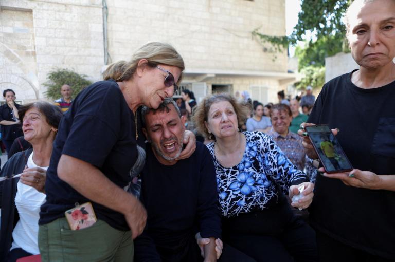 Worshippers attend a funeral at Greek Orthodox Saint Porphyrius Church, in Gaza City