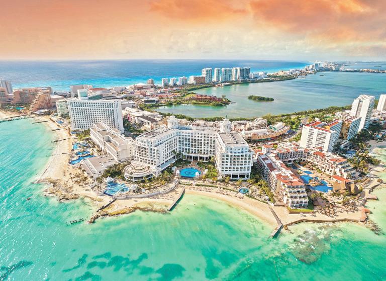 View of beautiful Hotels in the hotel zone of Cancun at sunset. Riviera Maya region in Quintana roo on Yucatan Peninsula