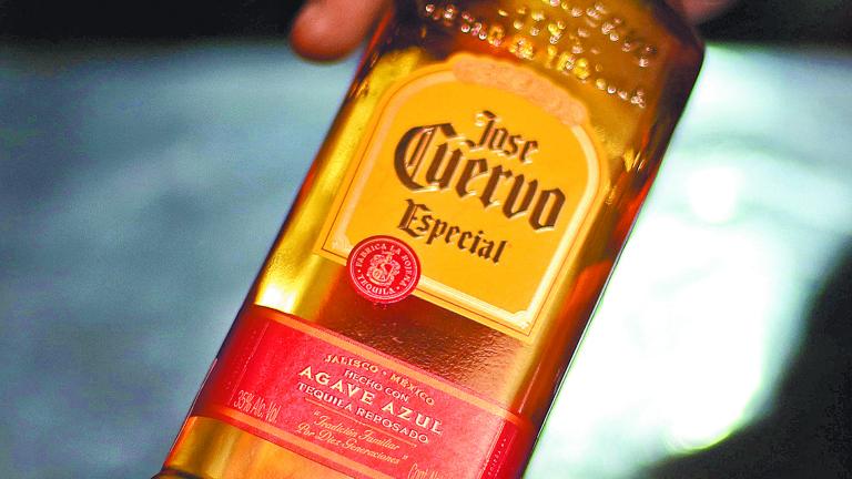 A man receives a bottle of Jose Cuervo Tequila in Mexico City