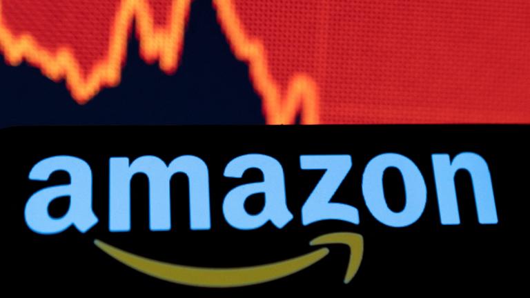 FILE PHOTO: Illustration shows Amazon logo and a decreasing stock graph