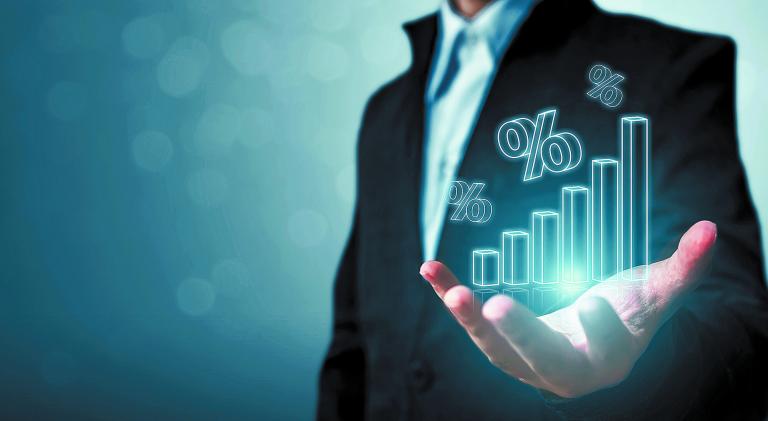 Interest rate financial and mortgage rates concept. Businessman hand show icon percent 3d sign with graph indicator