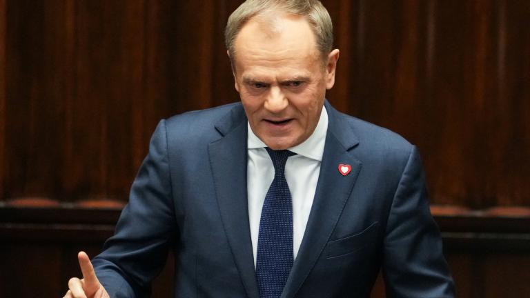 Leader of the Civic Coalition (KO) Donald Tusk gestures after the Parliament voted in favor of him becoming the Prime Minister, in Parliament, in Warsaw