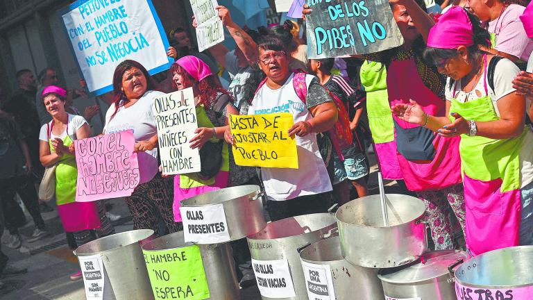 FILE PHOTO: Demonstrators protest outside the hotel where Argentina