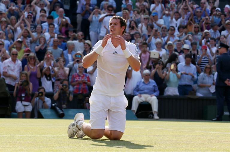 FILE PHOTO: Andy Murray of Britain reacts after defeating Novak Djokovic of Serbia in their men