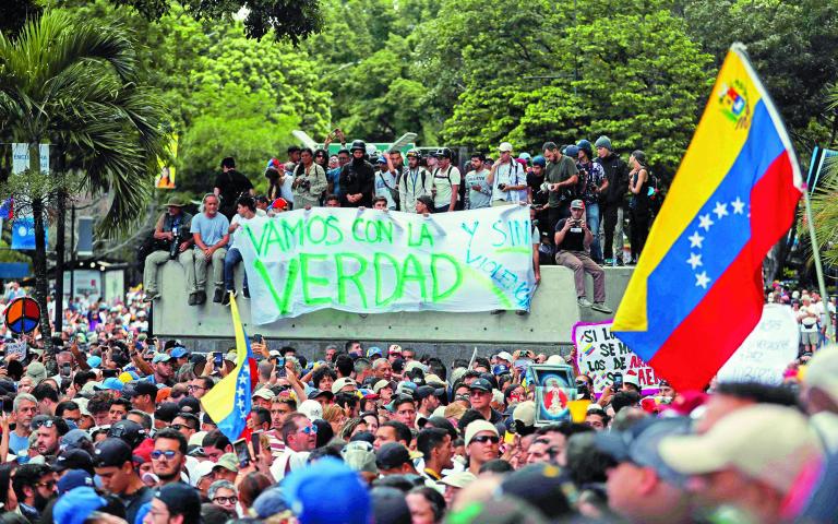 Anti-Maduro protests spread as Venezuelan opposition says he stole vote, in Caracas