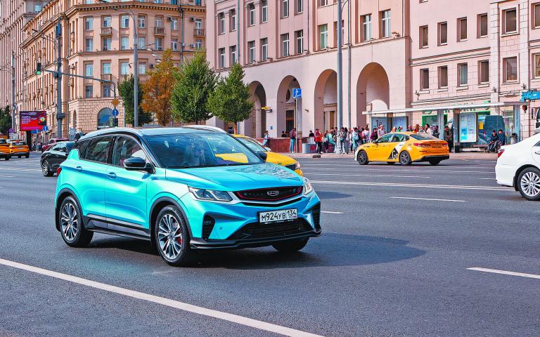 Blue Geely Coolray car in the flow of cars in the city. Chinese automobile. 09.23.2023 Moscow