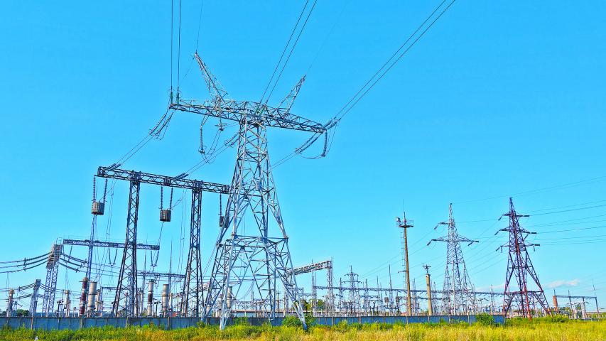 Image of high voltage substation. Distribution electrical power of pylons and equipment.