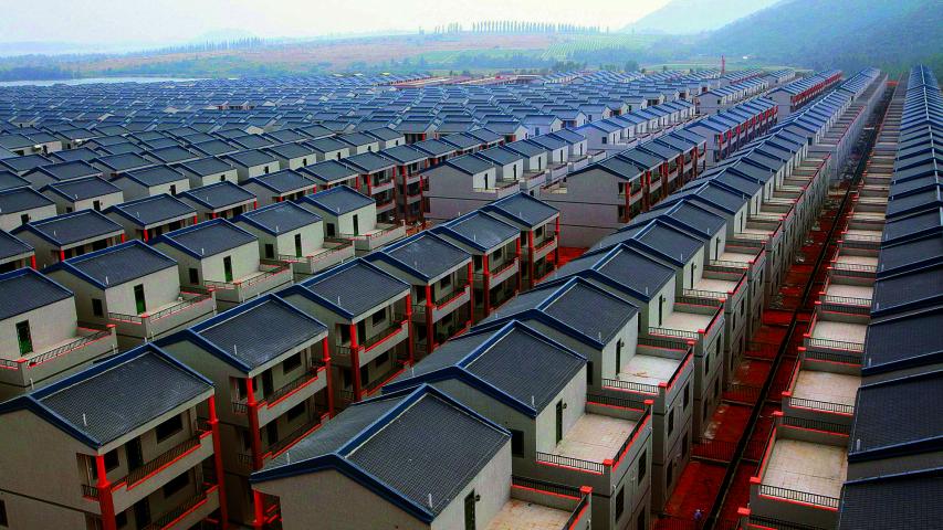 A general view of newly built houses at Dadun village of Lingshui ethnic Li Autonomous County, Hainan province, in this January 18, 2013 file photo. A property glut in some smaller cities raises questions over how far China's decade-long housing boom can last at a time when the fragile economy is more vulnerable than ever to a possible retreat in the red-hot property market.  REUTERS/Stringer/Files (CHINA - Tags: BUSINESS REAL ESTATE) CHINA OUT. NO COMMERCIAL OR EDITORIAL SALES IN CHINA