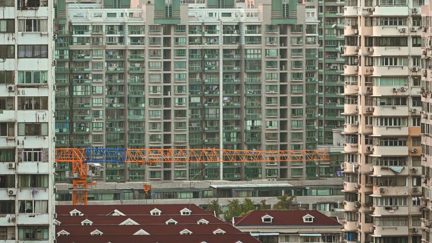 A general view shows buildings in a residential area in the Jing'an district in Shanghai on September 28, 2024. (Photo by Hector RETAMAL / AFP)