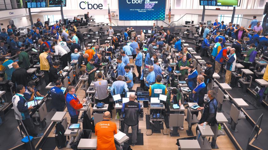 CHICAGO, ILLINOIS - JUNE 12: Traders work in the S&P options pit at the Cboe Global Markets exchange while awaiting news from the Fed meeting on June, 12, 2024 in Chicago, Illinois. The Federal Reserve today held interest rates at their current range of 5.25% to 5.5%, but revised its outlook for rate cuts to just one in 2024.   Scott Olson/Getty Images/AFP (Photo by SCOTT OLSON / GETTY IMAGES NORTH AMERICA / Getty Images via AFP)