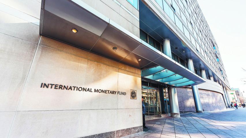 Washington DC, USA - March 9, 2018: IMF entrance with sign of International Monetary Fund, concrete architecture building wall security guard doors