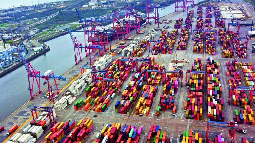 Aerial view showing containers in the port of Buenos Aires on the Rio de la Plata river (River Plate), on August 3, 2022. Economy 'super minister' Sergio Massa, who was appointed to oversee the economy, development and agriculture ministries as well as relations with international organizations, will be sworn-in on August 3. Argentina has suffered years of economic crisis, with some 37 percent of its population now living in poverty. Inflation for the first half of this year alone topped 36 percent, and is predicted to reach 80 percent by the year's end. (Photo by Luis ROBAYO / AFP)