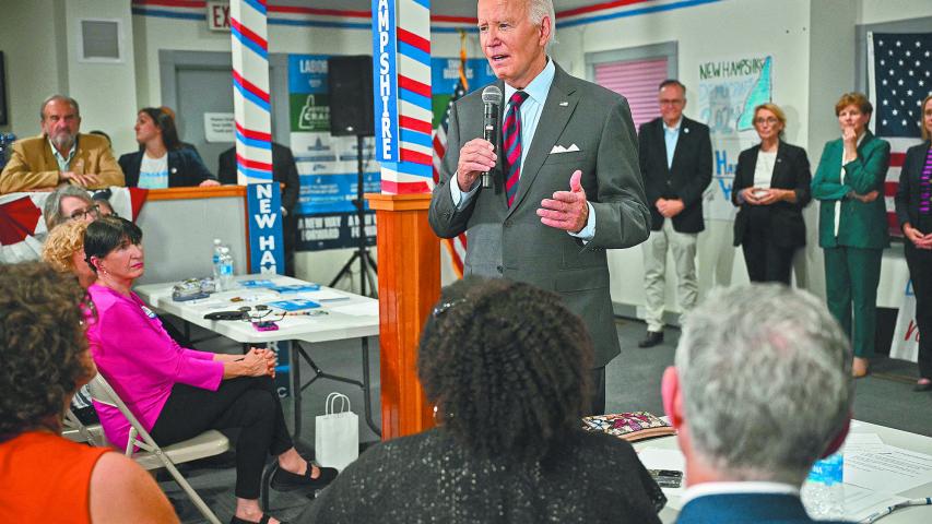 US President Joe Biden speaks to staff as he visits a New Hampshire Democratic coordinated campaign office in Concord, New Hampshire, on October 22, 2024. (Photo by Mandel NGAN / AFP)