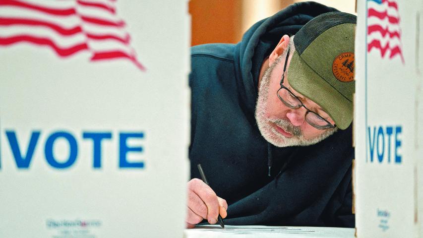 FILE PHOTO: Wisconsin resident Cary Pallas prepares to vote in the presidential primary election at the Central Assembly of God church polling place in Douglas County in Superior, Wisconsin, U.S. April 2, 2024. REUTERS/Erica Dischino/File Photo