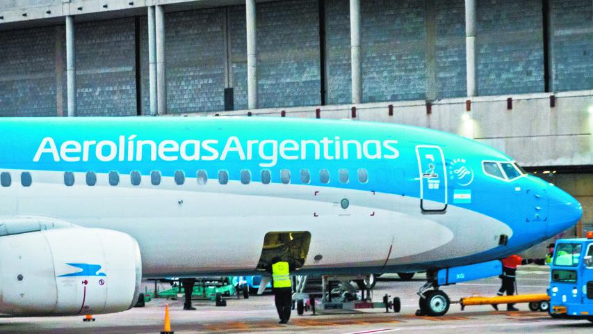 Buenos Aires, Argentina - Aug 10 2024: The staff are seen doing final inspections on an Aerolineas Argentinas aircraft.