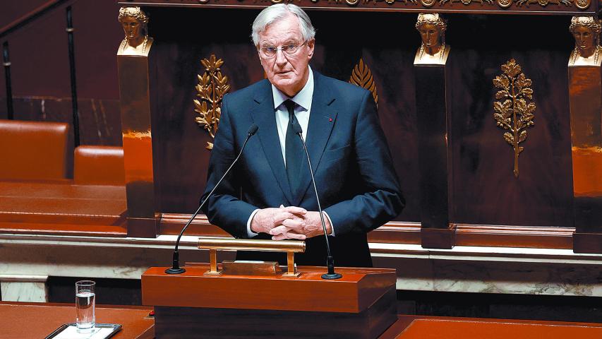 French Prime Minister Michel Barnier speaks to announce the use by the French government of article 49.3, a special clause in the French Constitution, to push the budget bill through the National Assembly without a vote by lawmakers, during a debate on the 2025 Social Security Financing bill (PLFSS) at the National Assembly in Paris, France, December 2, 2024. REUTERS/Sarah Meyssonnier