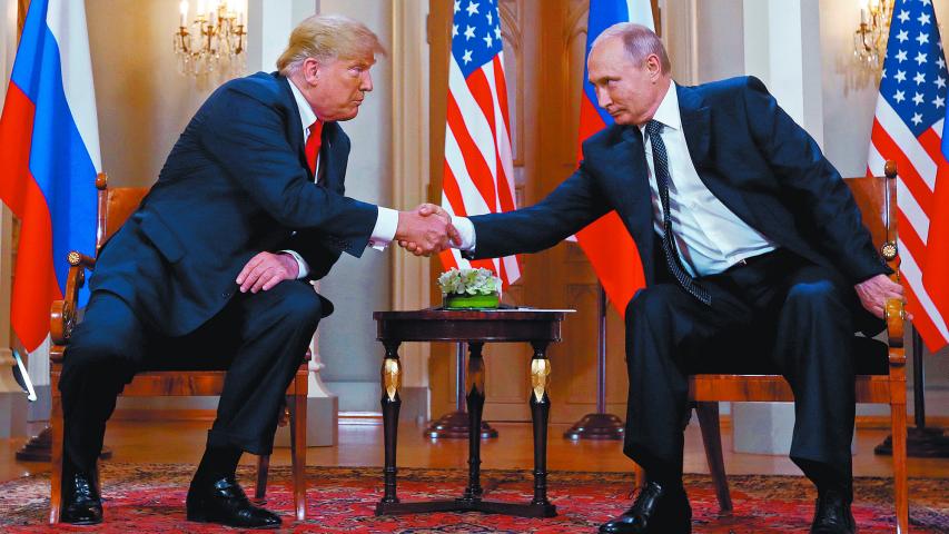 U.S. President Donald Trump and Russia's President Vladimir Putin shake hands as they meet in Helsinki, Finland July 16, 2018. REUTERS/Kevin Lamarque     TPX IMAGES OF THE DAY