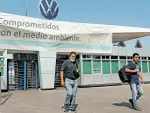 Employees leave the Volkswagen (VW) plant as the company will temporarily close its factories in Mexico amid growing worries over the spread of the coronavirus disease (COVID-19), in Puebla, Mexico March 29, 2020. REUTERS/Imelda Medina