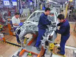 Employees work on the assembly line on the Jetta Bicentennial at the Volkswagen automobile manufacturing factory in Puebla