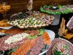 Layered stands with variety of sliced meat