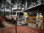 (FILES) Health workers move a patient to a hospital after he was cleared of having Ebola inside a MSF (Doctors Without Borders) supported Ebola Treatment Centre (ETC) on November 4, 2018 in Butembo, Democratic Republic of the Congo. An outbreak of the ebola virus has been blamed for dozens of deaths in the east of the Democratic Republic of the Congo, African health authorities said on May 15, 2026.The outbreak is in Ituri province. (Photo by John WESSELS / AFP)