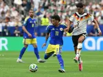 Curacao's forward #11 Jeremy Antonisse (C) fights for the ball with Germany's defender #05 Aleksandar Pavlovic (R)  during the 2026 World Cup Group E football match between Germany and Curacao at the Houston Stadium in Houston on June 14, 2026.  (Photo by RONALDO SCHEMIDT / AFP)