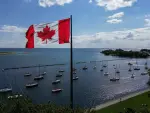 A Canadian flag flies along the waterfront of Lake Ontario, in Toronto, Ontario, Canada, on August 27, 2026. US President Donald Trump announced that he is renaming Lake Ontario -- a large body of water shared by the United States and Canada -- "Lake America." Trump signed an order in the White House in a move that comes amid a spiraling trade war between the world's largest economy and its northern neighbor. (Photo by Cole Burston / AFP)