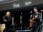 Bono and The Edge of U2 perform during the opening of the Barack Obama Presidential Center in Chicago, Illinois, on June 18, 2026. (Photo by Kamil Krzaczynski / AFP)