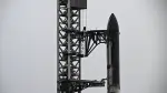 SpaceX's new Starship V3 rocket is seen docked at the Starbase during the 12th test flight on May 21, 2026 as seen from South Padre Island in Texas. Elon Musk's SpaceX is set for the debut launch of its latest Starship iteration on Thursday, testing the most powerful version yet of the megarocket as the company targets a blockbuster initial public offering. (Photo by RONALDO SCHEMIDT / AFP)