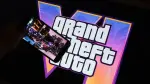 (FILES) This illustration photo created in Los Angeles, December 4, 2023, shows Rockstar Games Grand Theft Auto VI trailer played on a screen in front of the game title. Thirteen years of waiting are about to come to an end: the video game "Grand Theft Auto VI," the latest installment in the saga from US studio Rockstar Games, opens for pre-orders on June 25, 2026, and is poised to become the biggest launch of a cultural product in history. (Photo by Chris DELMAS / AFP)