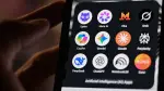 This photograph shows a handheld smartphone displaying the icons of some of the main artificial intelligence based apps, including LLMs, chatbots and generative AI, with logos (from L) of Proton AG's Lumo, Meta AI, Mistral Vibe (formerly Le Chat), xAI's Grok, Microsoft's Copilot, Google's Gemini, Anthropic's Claude, Perplexity, Deepseek, OpenAI's Chat GPT, Google's Notebook LLM and generative AI music app Suno, in Saint-Mande, east of Paris, on July 15, 2026. (Photo by Martin LELIEVRE / AFP)