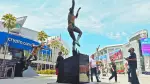 LOS ANGELES, CALIFORNIA - AUGUST 12: People gather near a statue of Kareem Abdul-Jabbar outside Crypto.com Arena, home of the NBA's Los Angeles Lakers, on August 12, 2026 in Los Angeles, California. Los Angeles Lakers owner Mark Walter is reportedly selling the Lakers to venture capitalist Joshua Kushner, brother of President Trump's son-in-law Jared Kushner, and former Disney CEO Bob Iger for a record $12.5 billion.   Mario Tama/Getty Images/AFP (Photo by MARIO TAMA / GETTY IMAGES NORTH AMERICA / Getty Images via AFP)