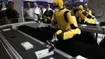 Humanoid robots by DexForce demonstrate working at a smartphone assembly and inspection production line during the 2026 World Robot Conference, in Beijing, China August 19, 2026. REUTERS/Tingshu Wang