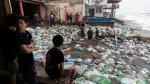 Residents place sandbags as a protective barrier against strong waves generated by Hurricane Polo at Playa Azul, in the municipality of Lazaro Cardenas, Michoacan, Mexico, on September 23, 2026. Hurricane Polo strengthened to the highest category on September 22 in the Mexican Pacific, with no forecast of making landfall but with heavy rainfall expected. Polo intensified from Category 1 to Category 5 on the Saffir-Simpson scale in less than 24 hours. (Photo by Enrique Castro / AFP)