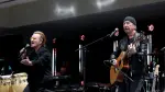 Bono and The Edge of U2 perform during the opening of the Barack Obama Presidential Center in Chicago, Illinois, on June 18, 2026. (Photo by Kamil Krzaczynski / AFP)