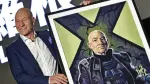"Professor X" in the X-Men series' Patrick Stewart poses for photos with a gift of a painting during a press conference for the film "Logan" in Taipei on February 28, 2017. Stewart and fellow cast member Hugh Jackman were in Taiwan to promote their latest movie "Logan". (Photo by Sam YEH / AFP)