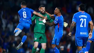 Soccer Football - Liga MX - Quater Final - Second Leg - Cruz Azul v Guadalajara - Estadio Azteca, Mexico City, Mexico - November 30, 2025 Cruz Azul's Andres Gudino celebrates with teammates after Guadalajara's Chicharito misses a penalty REUTERS/Eloisa Sanchez