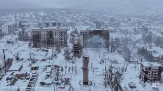 This handout photograph, taken on December 29, 2025, and released by the press service of the 116th Separate Mechanized Brigade of the Ukrainian Ground Forces on December 30, shows an aerial view of heavily damaged residential buildings in the frontline town of Kupiansk, Kharkiv region, amid the Russian invasion of Ukraine. (Photo by Handout / 116th Separate Mechanized Brigade of the Ukrainian Ground Forces / AFP) / XGTY / RESTRICTED TO EDITORIAL USE - MANDATORY CREDIT "AFP PHOTO / 116TH SEPARATE MECHANIZED BRIGADE OF THE UKRAINIAN GROUND FORCES" - NO MARKETING NO ADVERTISING CAMPAIGNS - DISTRIBUTED AS A SERVICE TO CLIENTS