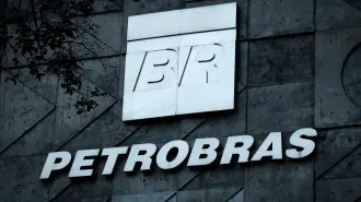 (FILES) A logo of Brazilian oil company Petrobras is seen at the entrance of its headquarters in Rio de Janeiro, Brazil, on July 15, 2016. Brazilian state-owned giant oil company Petrobras tripled its profits in 2025 compared to the previous year, driven by record oil and gas production, according to the company's annual results released on March 5, 2026. (Photo by YASUYOSHI CHIBA / AFP)