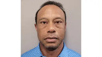 This handout mugshot released on March 27, 2026 provided by the Martin County Sheriff's Office shows the mugshot of US golfer Tiger Woods, 50, who was arrested in Jupiter Island, Florida on March 27, 2026. The golf icon was arrested and charged with driving under the influence after a rollover crash near his Florida home, authorities said. (Photo by HANDOUT / Florida Department of Corrections / AFP) / RESTRICTED TO EDITORIAL USE - MANDATORY CREDIT "AFP PHOTO / Martin County Sheriff's Office" - HANDOUT - NO MARKETING NO ADVERTISING CAMPAIGNS - DISTRIBUTED AS A SERVICE TO CLIENTS