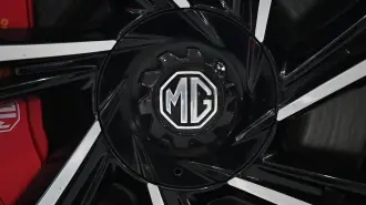 The MG logo is seen on an MG Cyberster at the Beijing Auto Show in Beijing on April 26, 2026. (Photo by GREG BAKER / AFP)