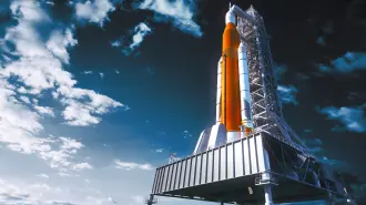 Space Launch System On Launchpad Over Background Of Sky. 3D Illustration.