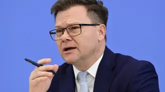 German Minister for the Environment, Climate Protection, Nature Conservation and Nuclear Safety Carsten Schneider delivers a press conference to present his report 'Program for Climate Protection 2026' at the BPK (Bundespressekonferenz) building in Berlin, on March 25, 2026. (Photo by John MACDOUGALL / AFP)