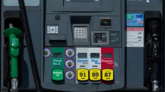 FILE PHOTO: The price of gasoline is displayed on gas pumps at the gas station near the highway in Encinitas, California, U.S., April 30, 2026.   REUTERS/Mike Blake/File Photo